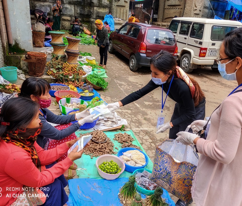 FPA India Nagaland Branch distributed sanitary pads manufactured from its Sanitary Pads Production Centre and face mask to women vegetable vendors in Kohima town. (Photo Courtesy: FPA India Nagaland Branch)